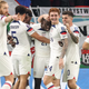 The USMNT celebrates Tim Weah’s goal in their group stage opener at the World Cup in Qatar.